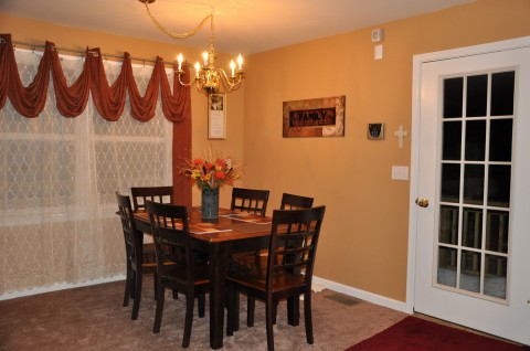 Dining room table has 3 leaves and can open to seat 12.